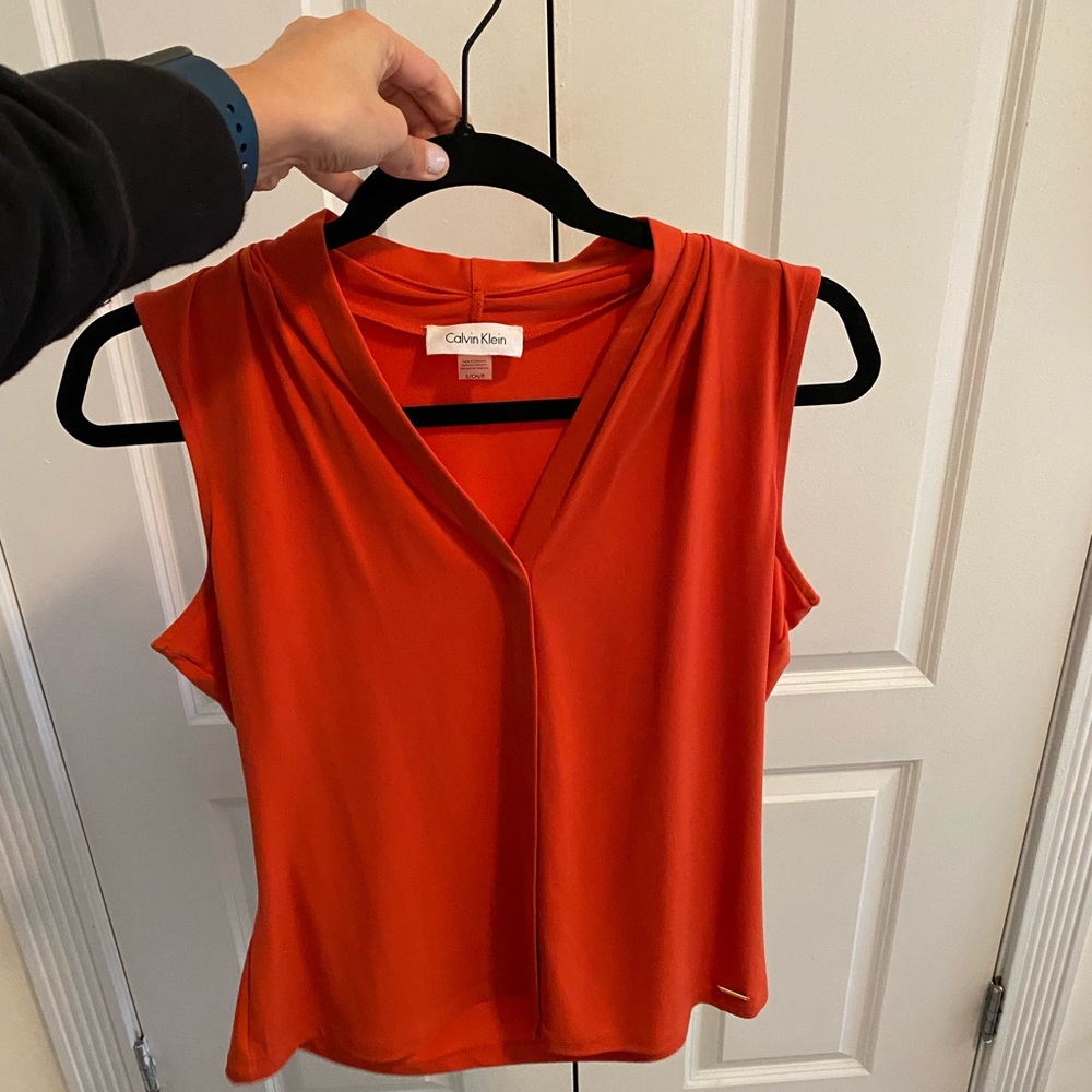Calvin Klein Orange Dressy Blouse. Great Condition. Perfect for work. Size Small